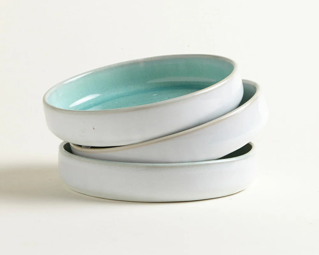 Stack of handmade Onomao turquoise mezze plates