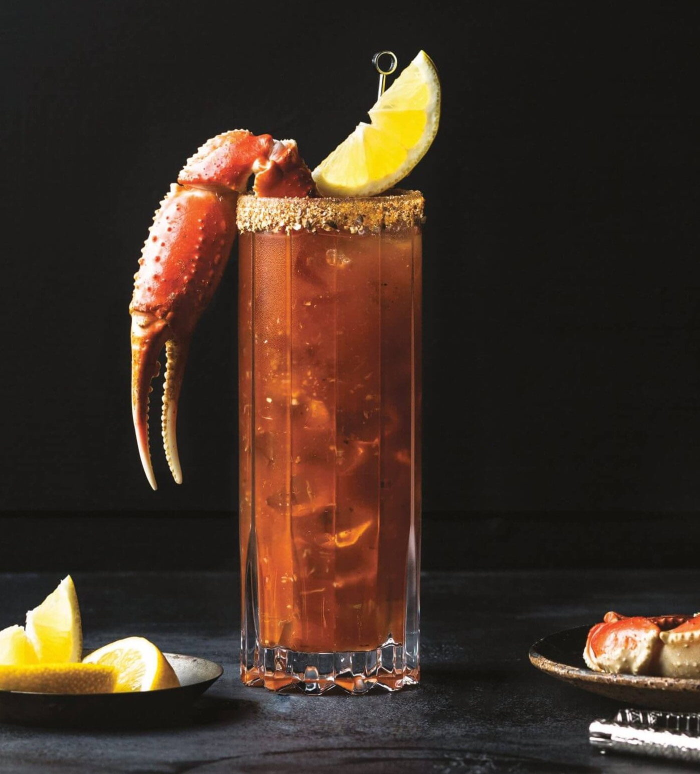 One of the best caesar cocktail recipes with a snow crab claw and lemon wedge.