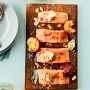 pieces of salmon on a cedar plank