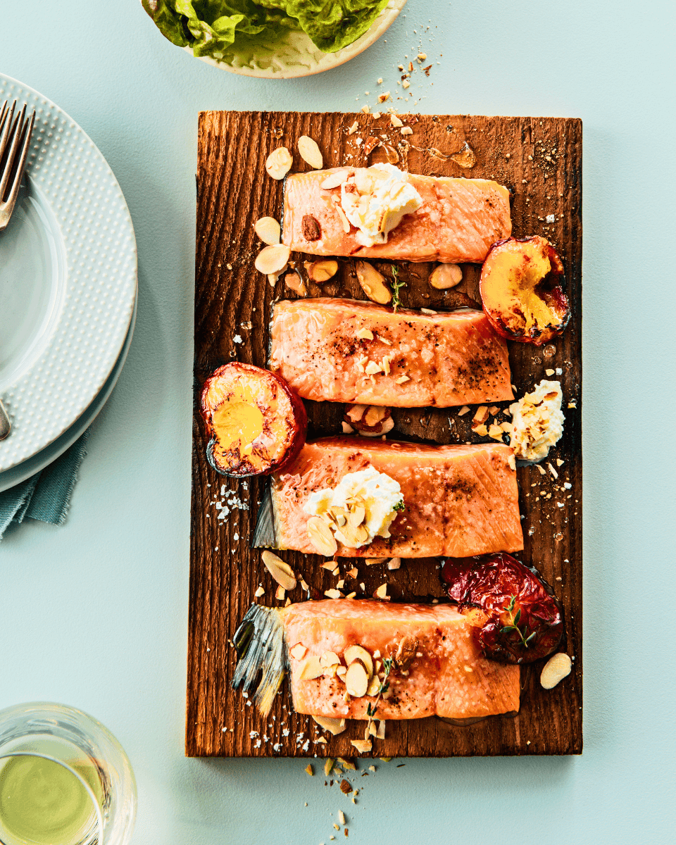 pieces of salmon on a cedar plank