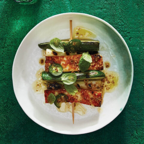 Grilled halloumi and cucumber skewers with spring onions served with a lemon herb dressing