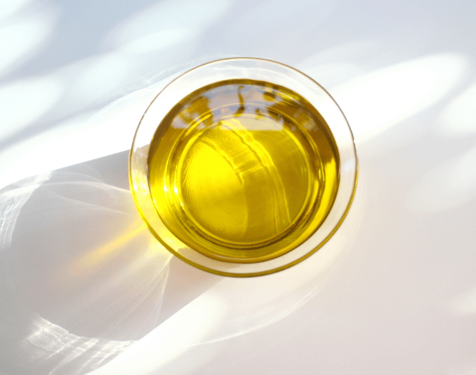 overhead glass of yellow liquid