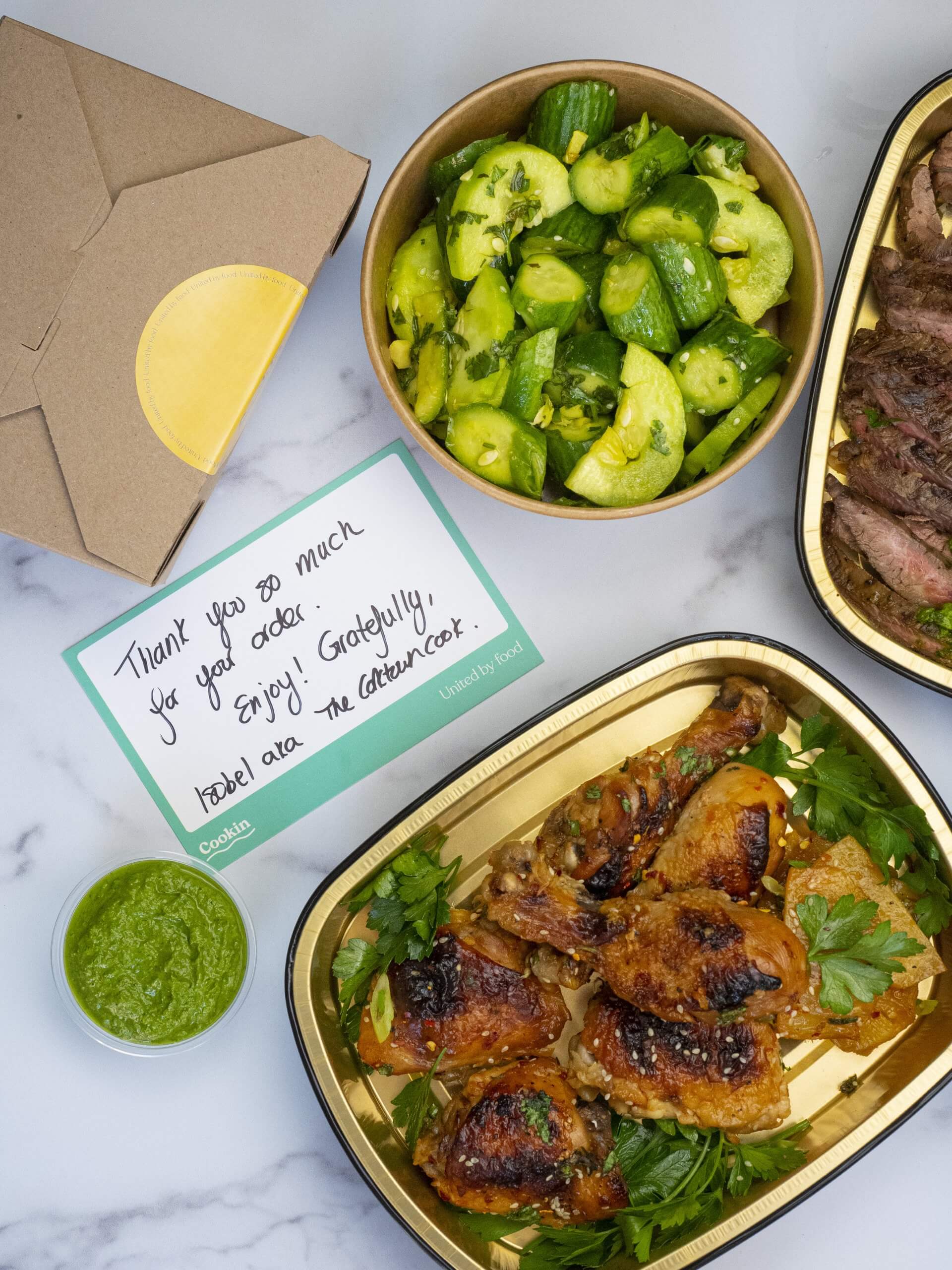 A handwritten note next to takeout containers