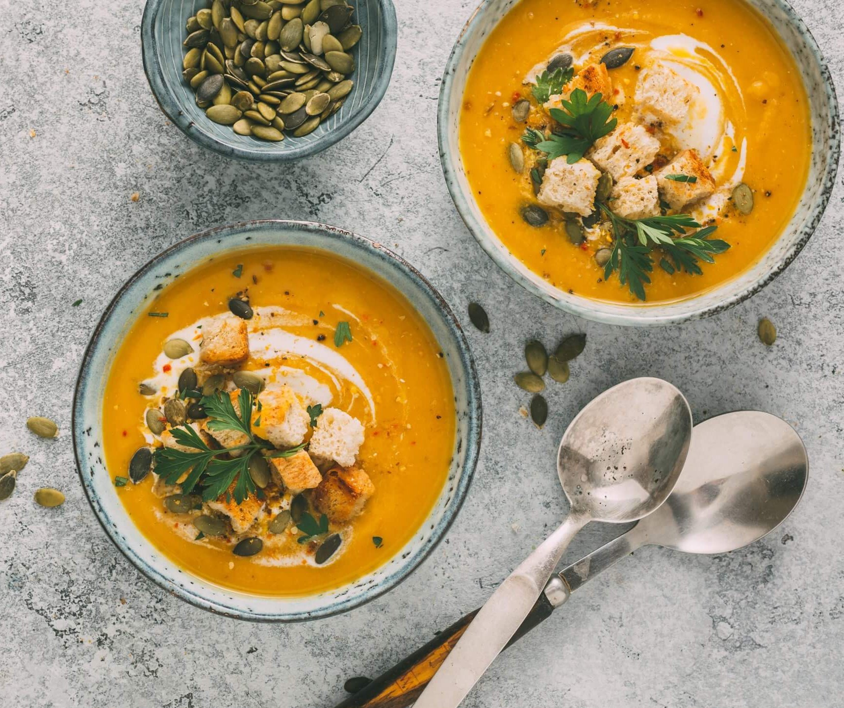 Pumpkin Soup with with croutons and pumpkin seeds, Top view.