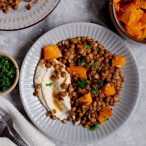Red rice, lentils and butternut squash with carrot and quinoa in a herby dressing, healthy clean eating concept