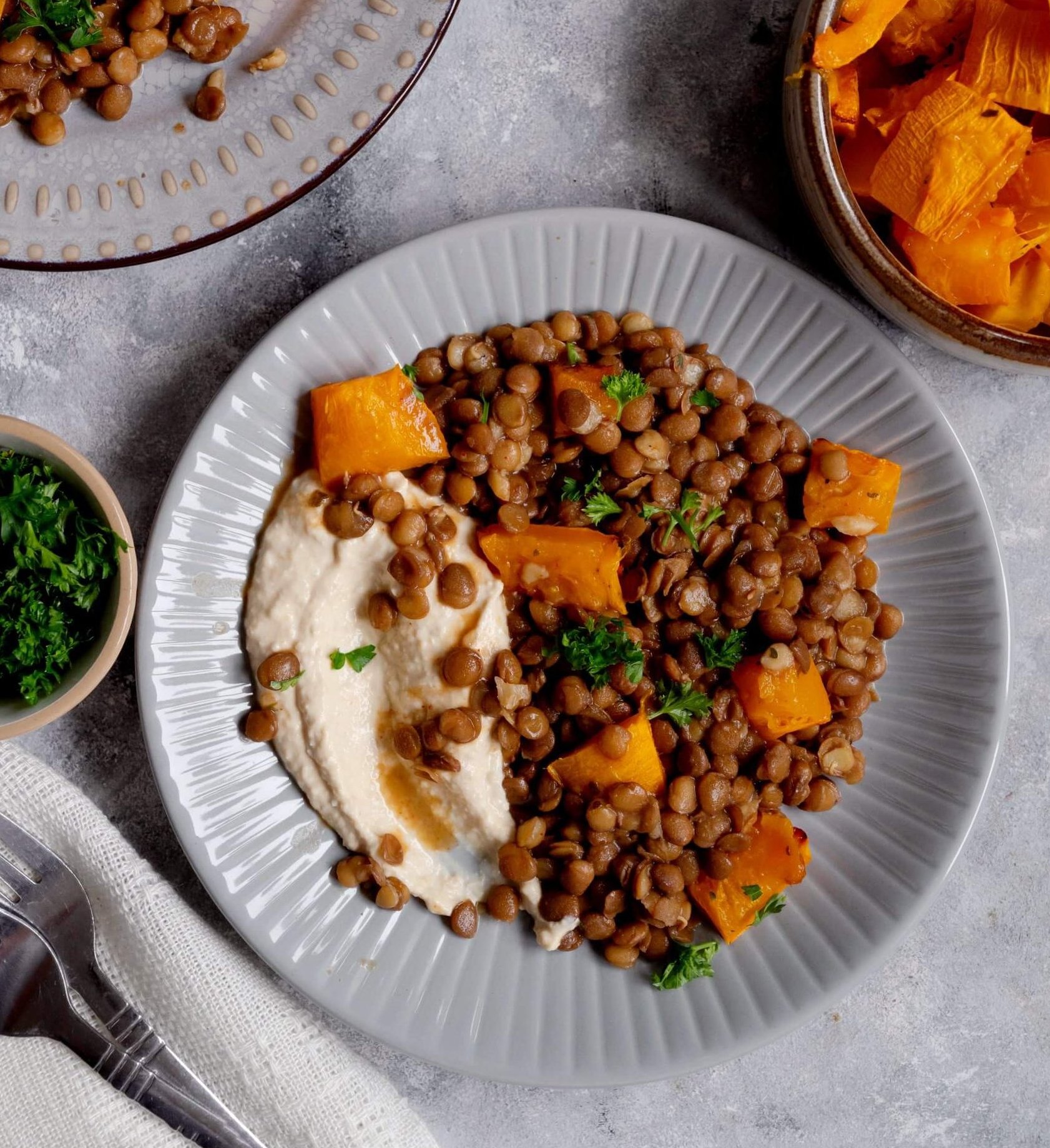Red rice, lentils and butternut squash with carrot and quinoa in a herby dressing, healthy clean eating concept