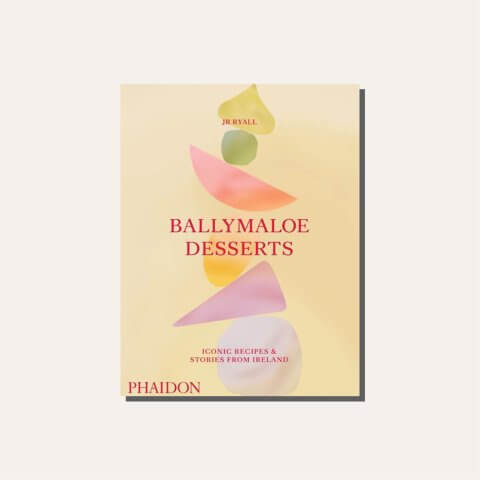 A yellow cookbook cover in a light frame.