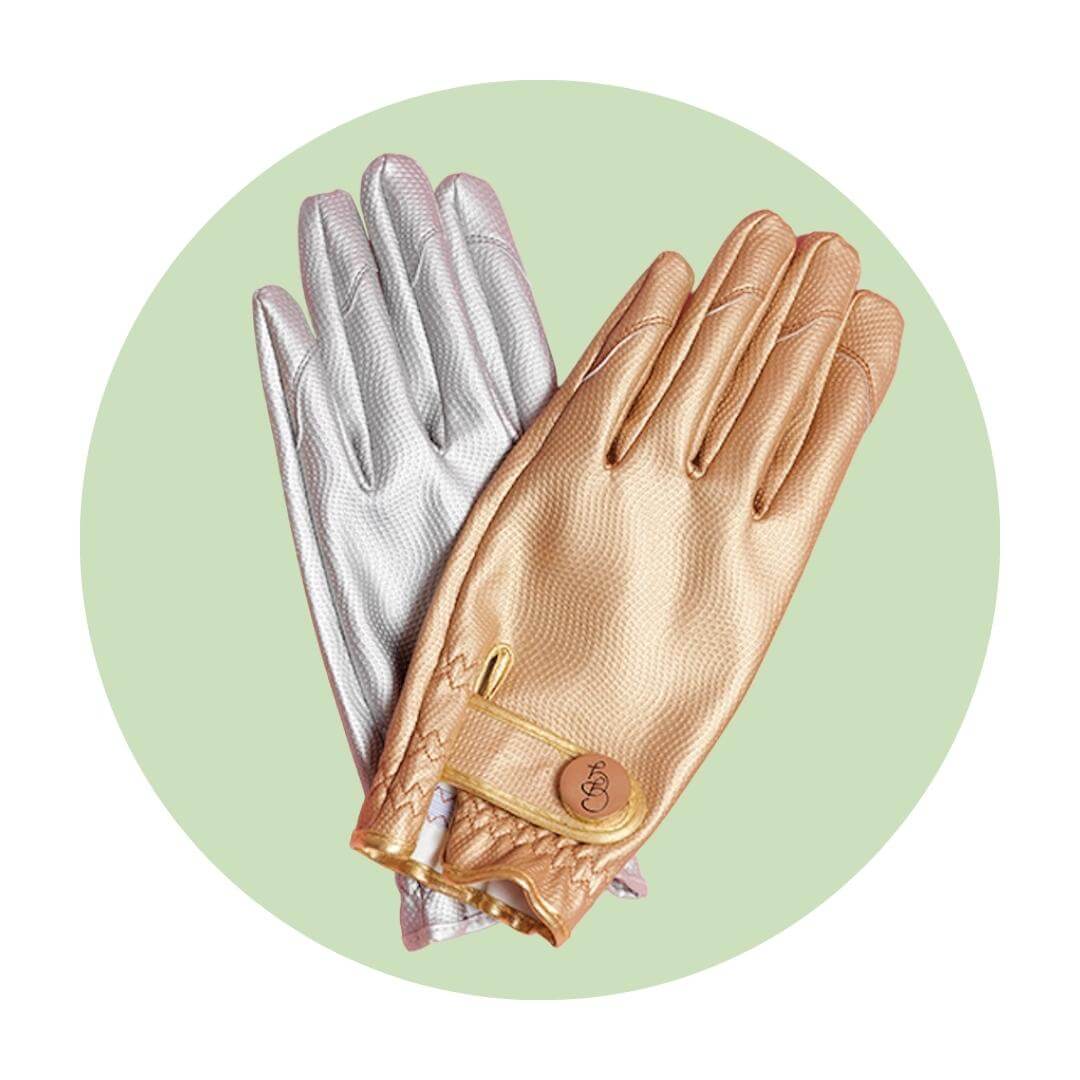 A silver glove and a gold glove on top of a light green circle