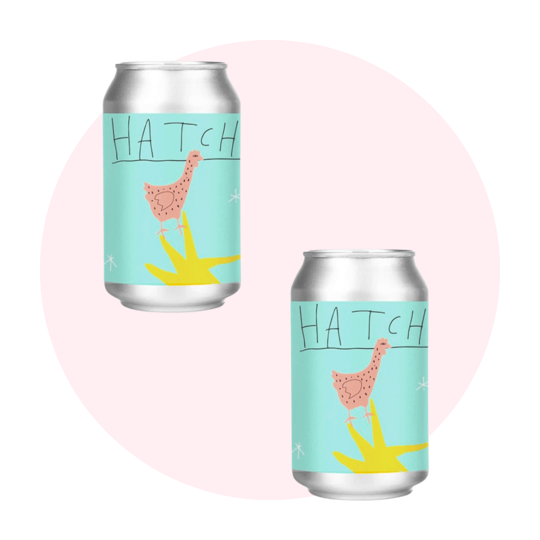 two beer cans on pink circle background