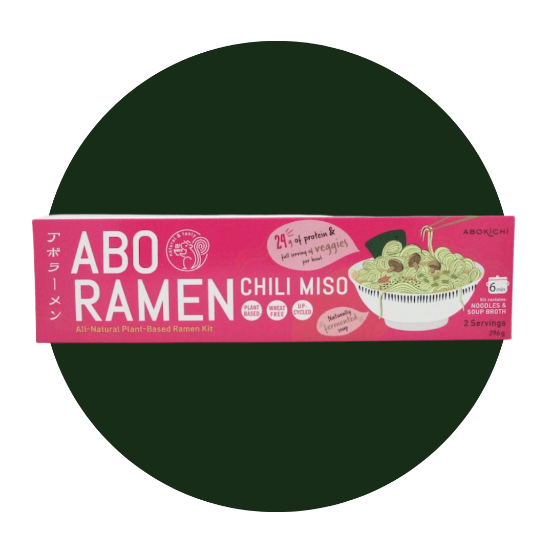 A pink box of ramen on a dark green circle