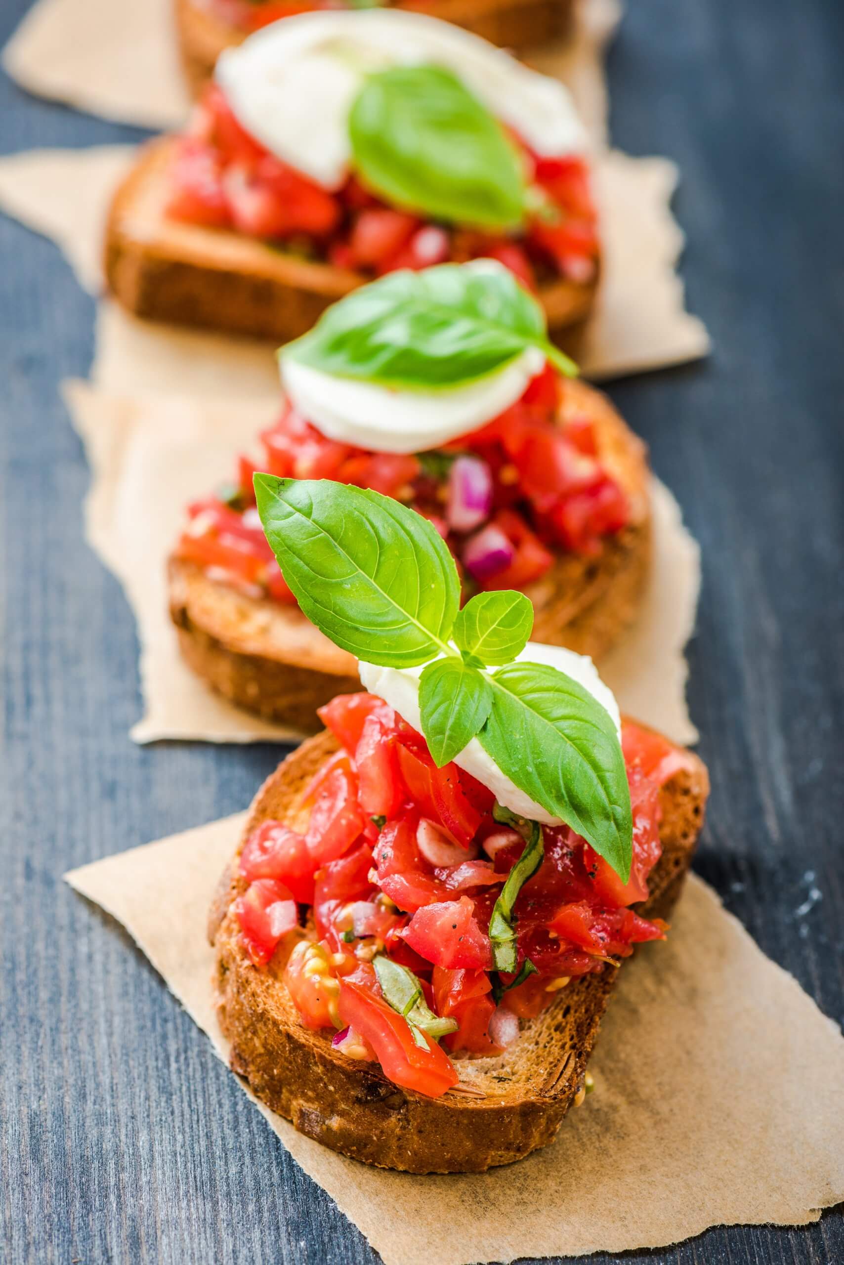 chopped tomatoes on toast with basil