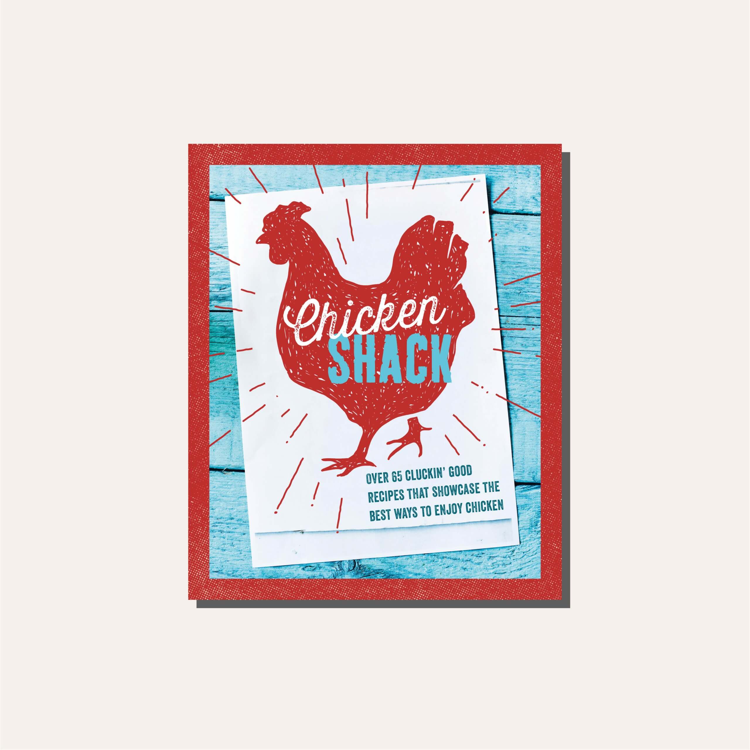 A red and blue cookbook cover in a light tan frame