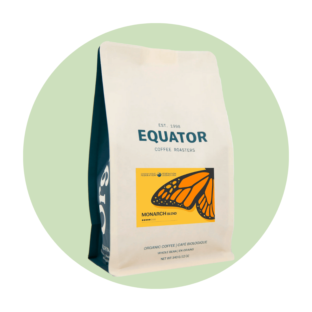 A bag of coffee with a monarch butterfly on a light green circle