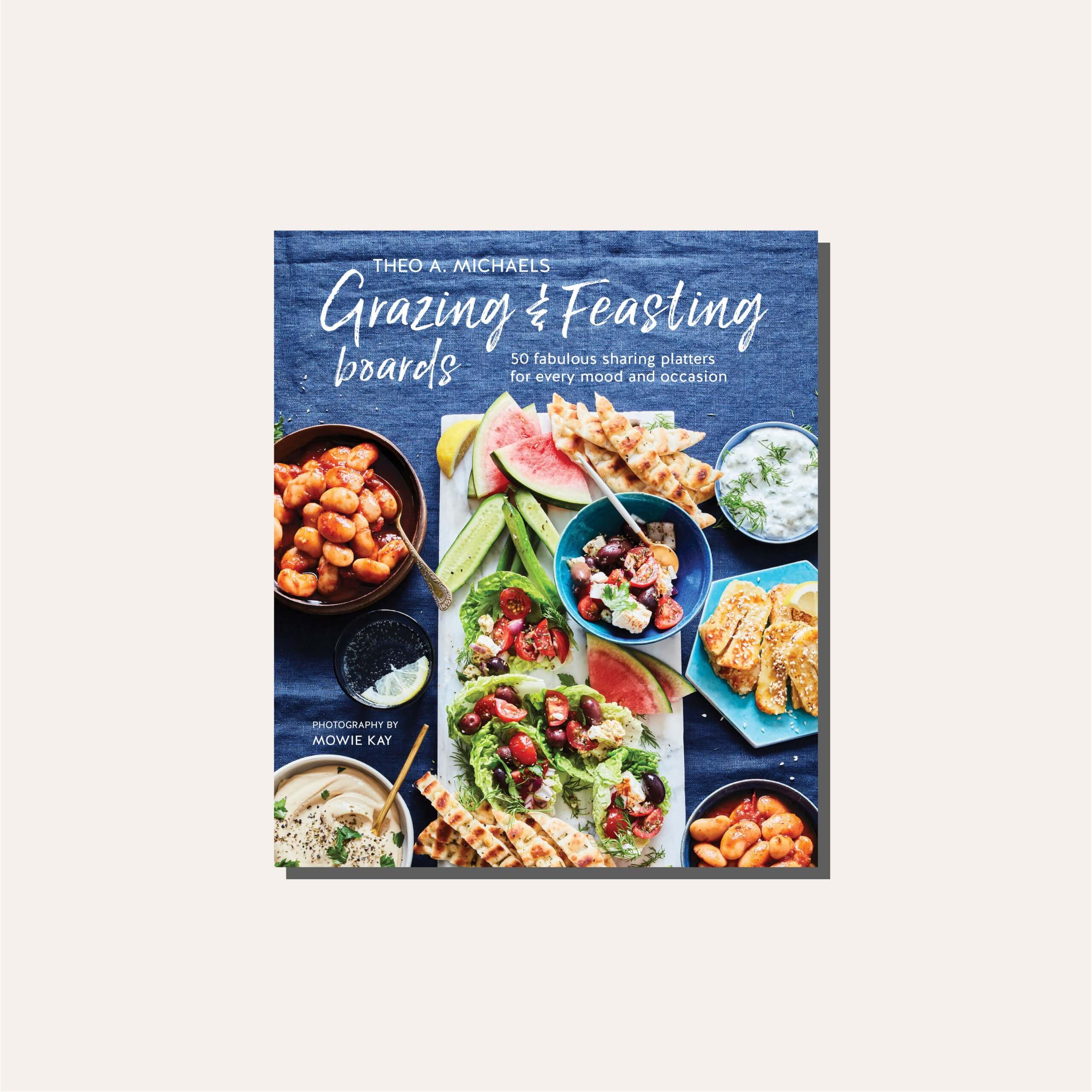 A dark blue cookbook cover in a light frame