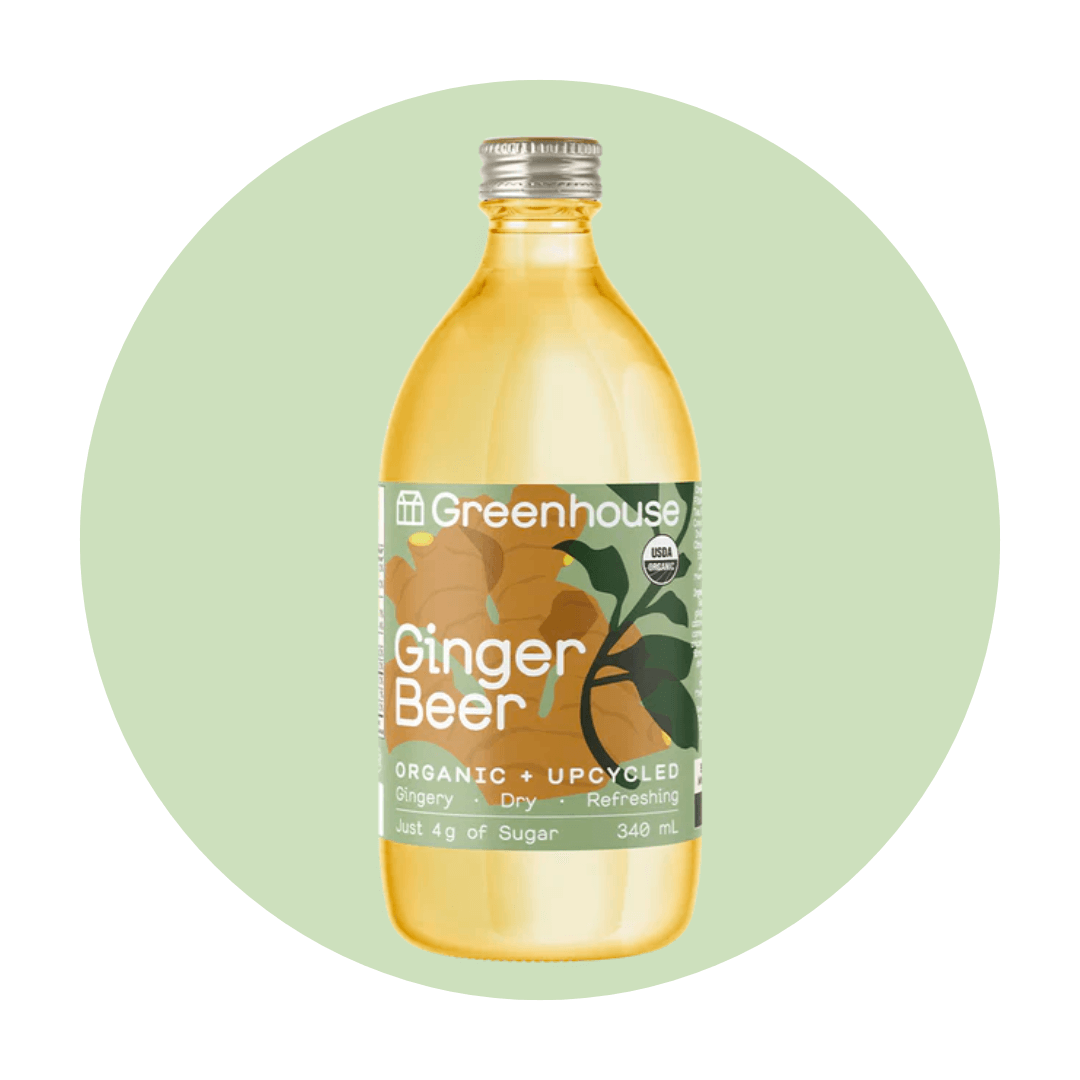 A bottle of ginger beer on a light green circle