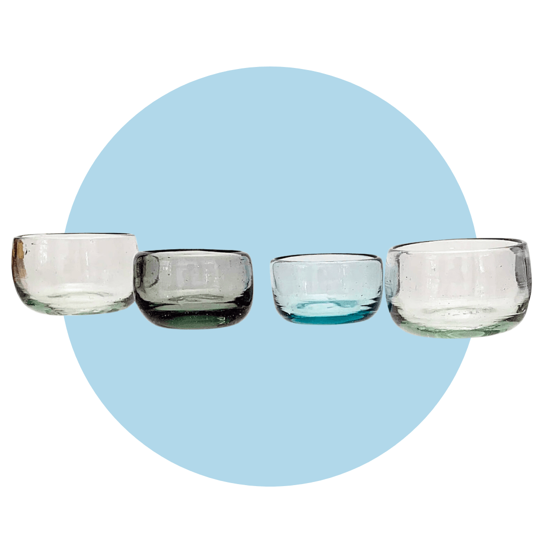 Four glass copitas on a light blue circle graphic