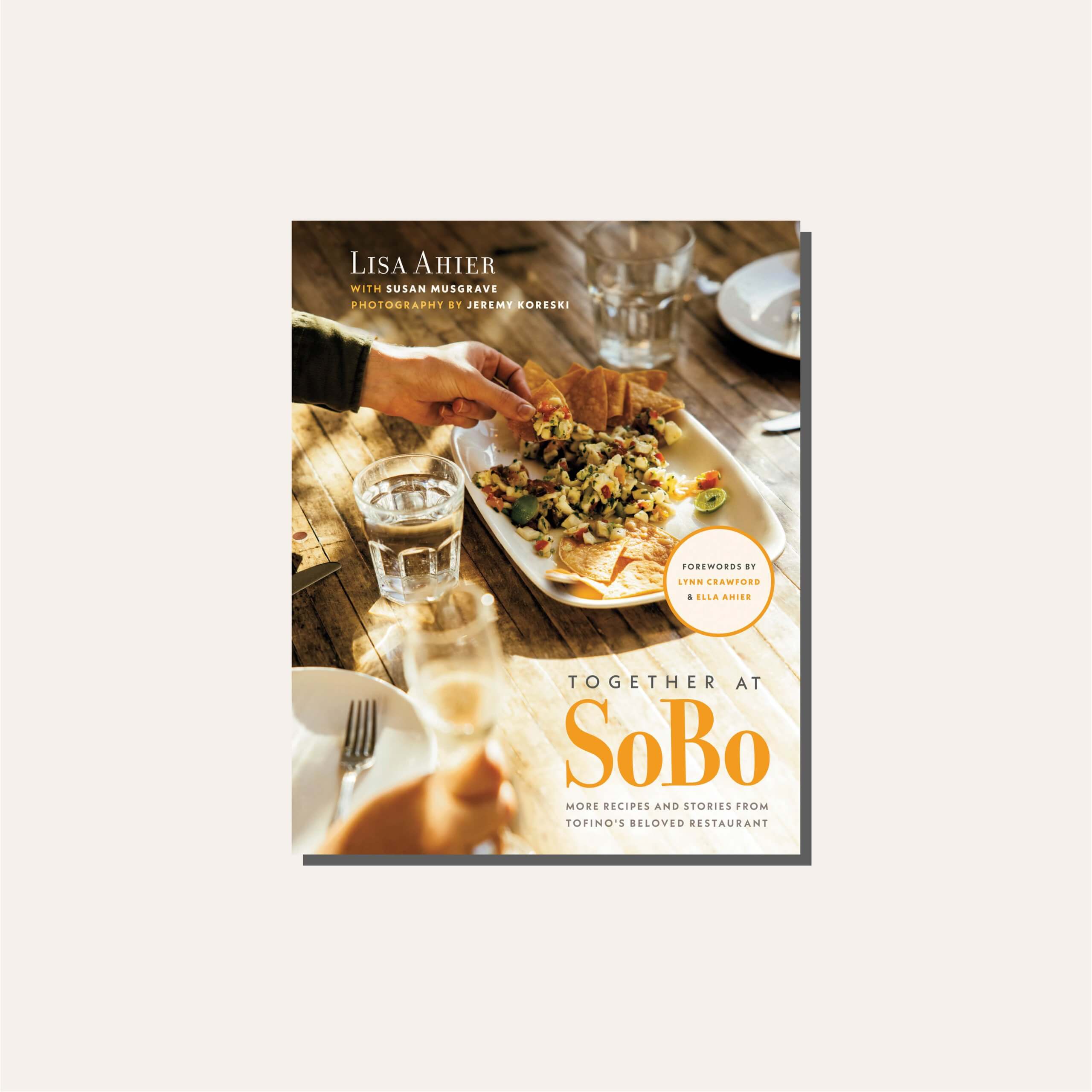 A cookbook cover in a light tan frame.