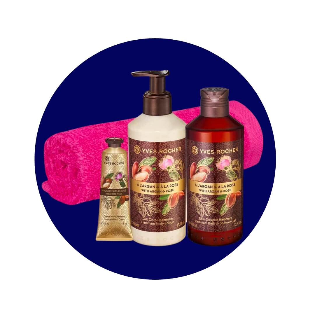Three skincare products and a hot pink towel on a dark blue circle graphic