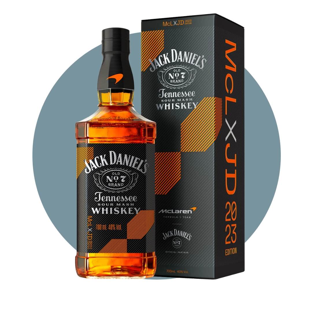 A bottle of Jack Daniels with a black and orange box on a steel blue circle graphic