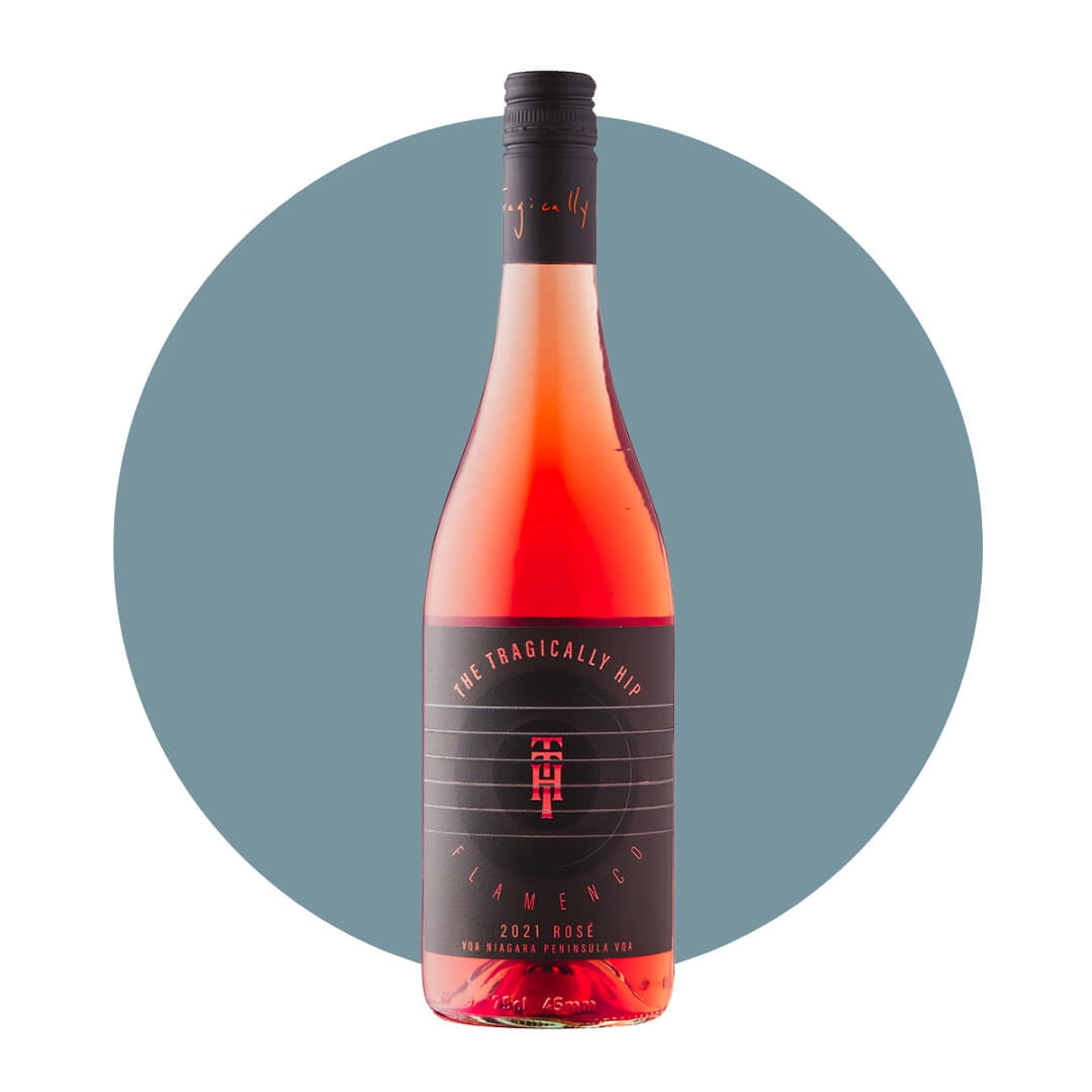 A bottle of rosé wine with a black label and cap