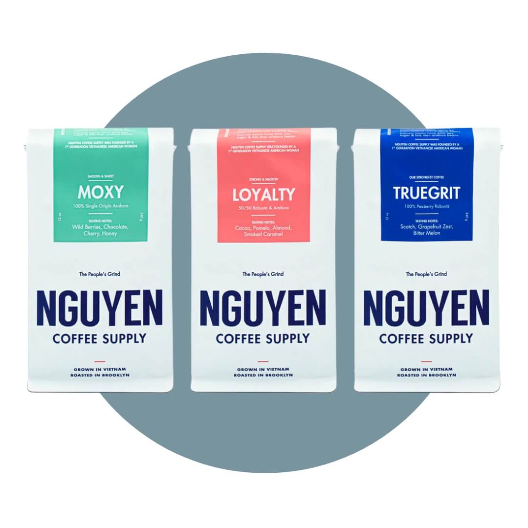 Three white bags with different coloured labels on a blue circle graphic