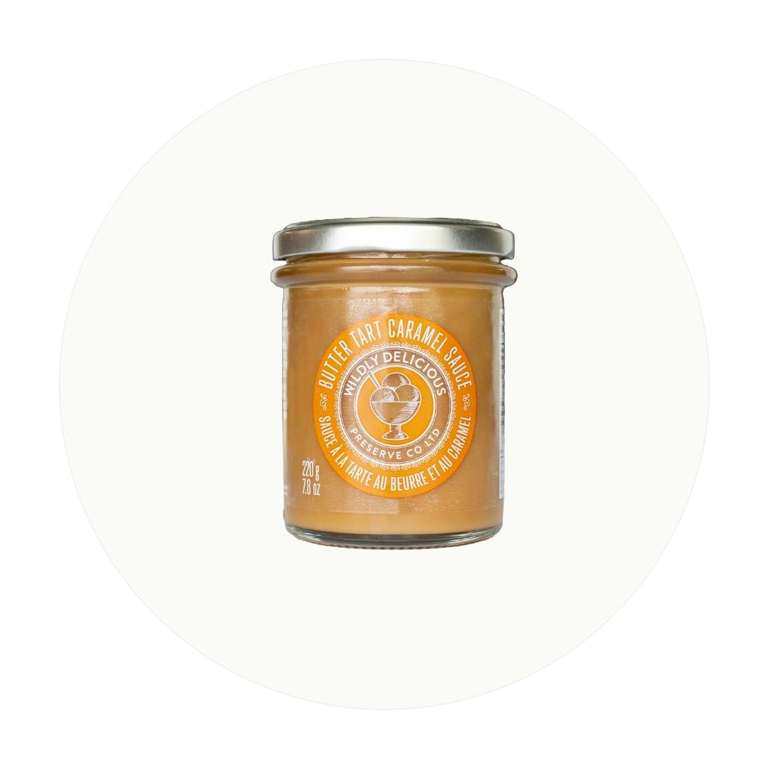 A jar of caramel-coloured sauce on an off-white circle graphic