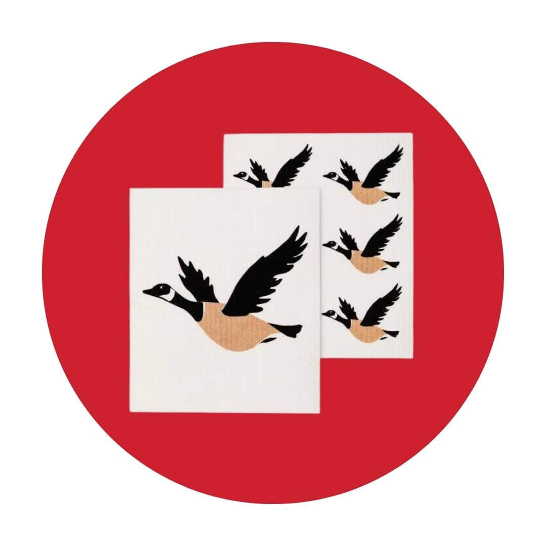 Two white cloths with illustrations of Canada geese on a red circle graphic