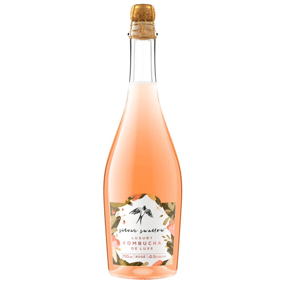 A corked bottle of rose wine with a white label that has a floral design and a sketch of a bird