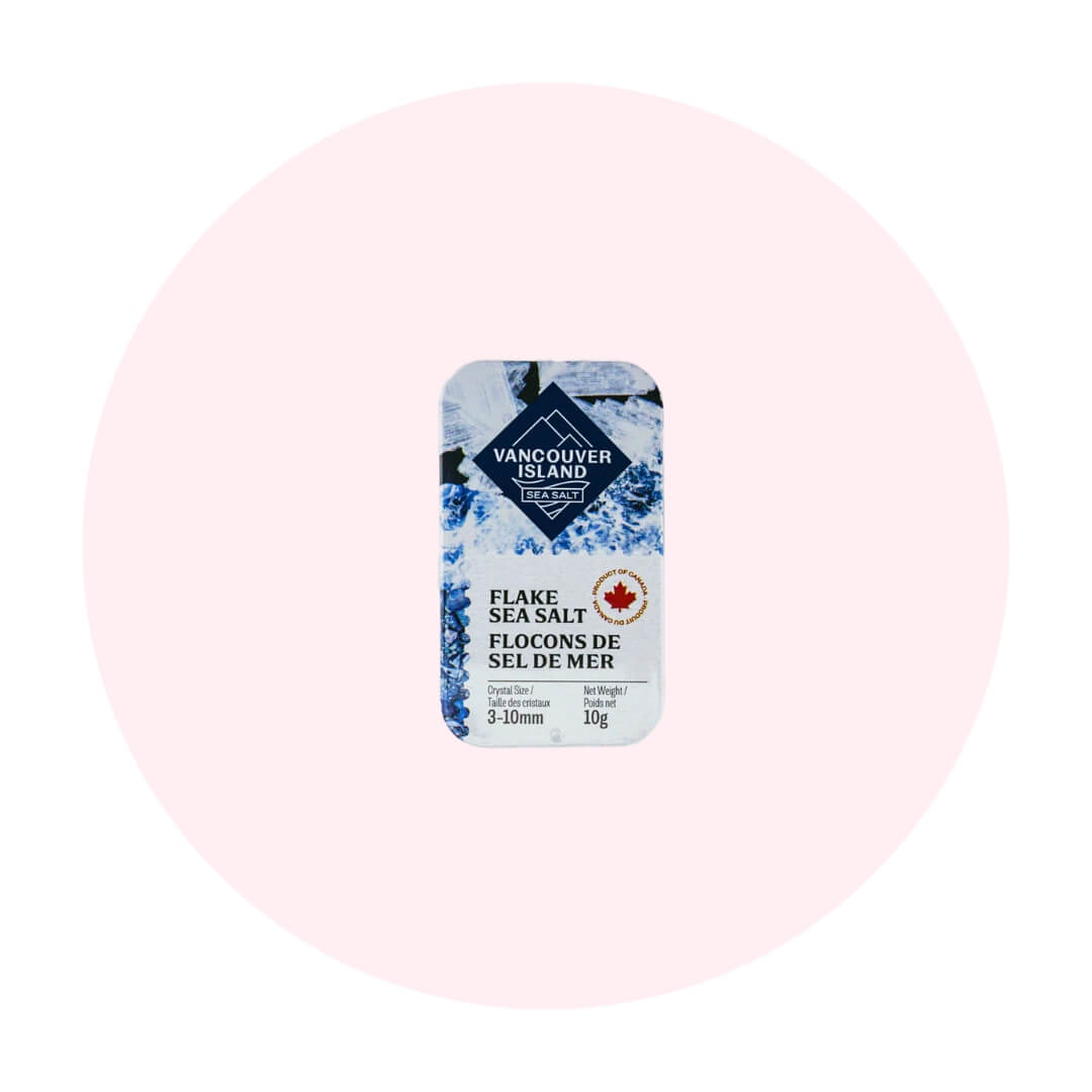 A small blue tin on a pale pink circle graphic