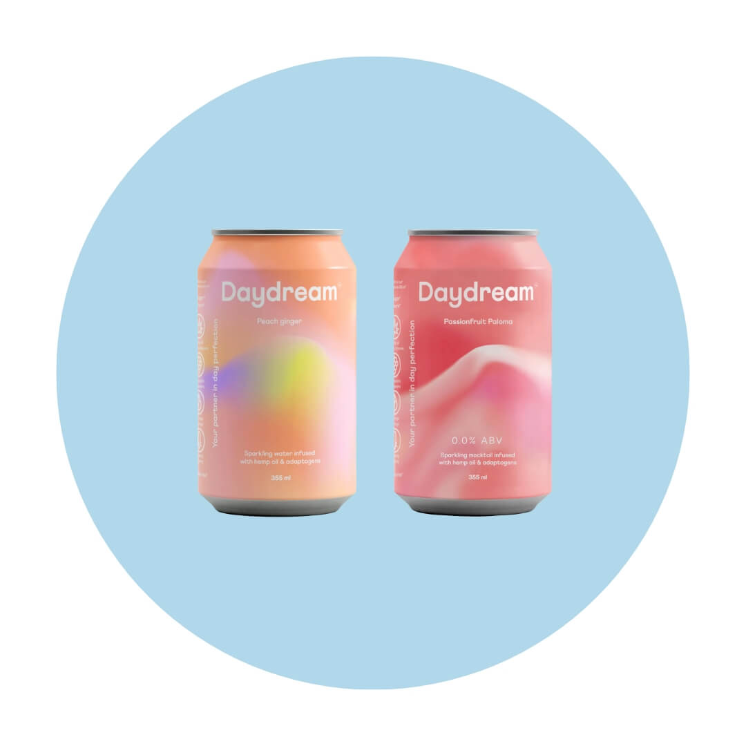An orange can and a pink can with wavy abstract designs and the word "daydream" on a light blue circle graphic