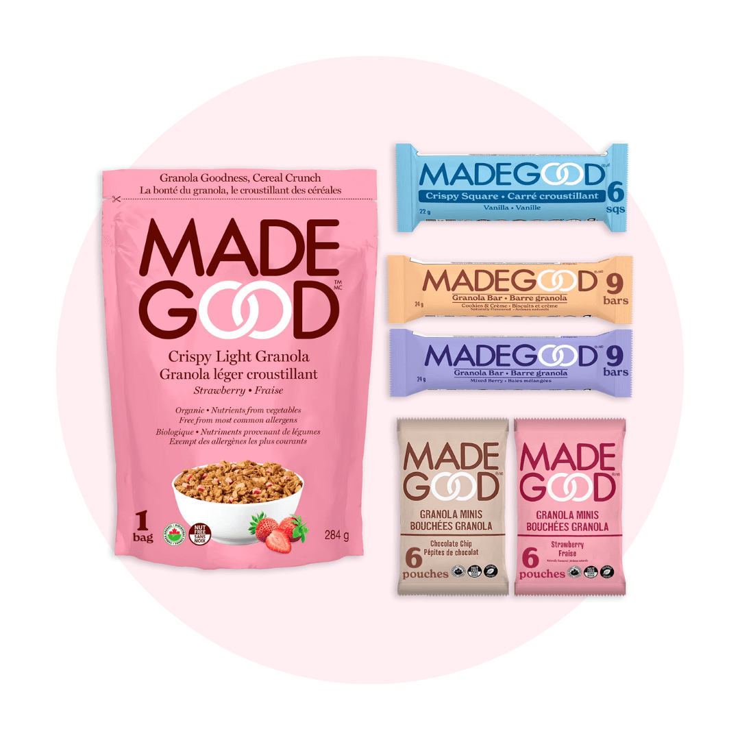 An assortment of packaged snacks on a pale pink circle graphic