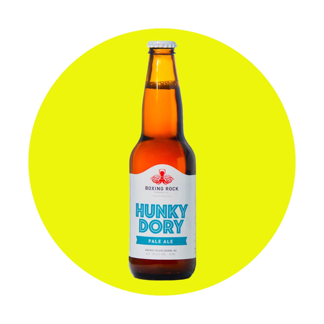 A bottle of beer with a blue and white label over a neon yellow circle graphic