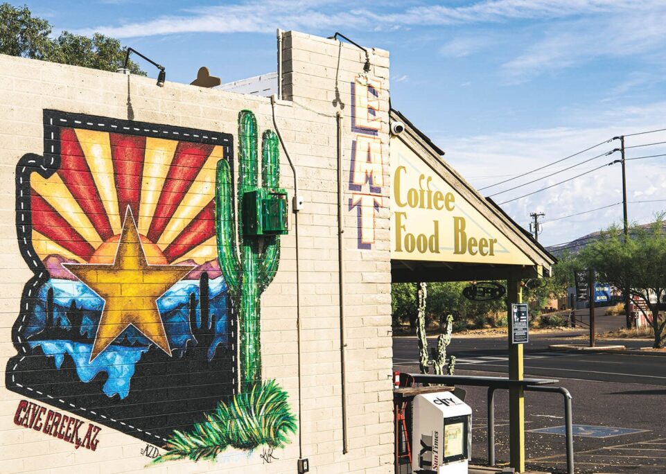 The exterior of Local Jonny's Coffee and Food Bar in Cave Creek Arizona with a mural