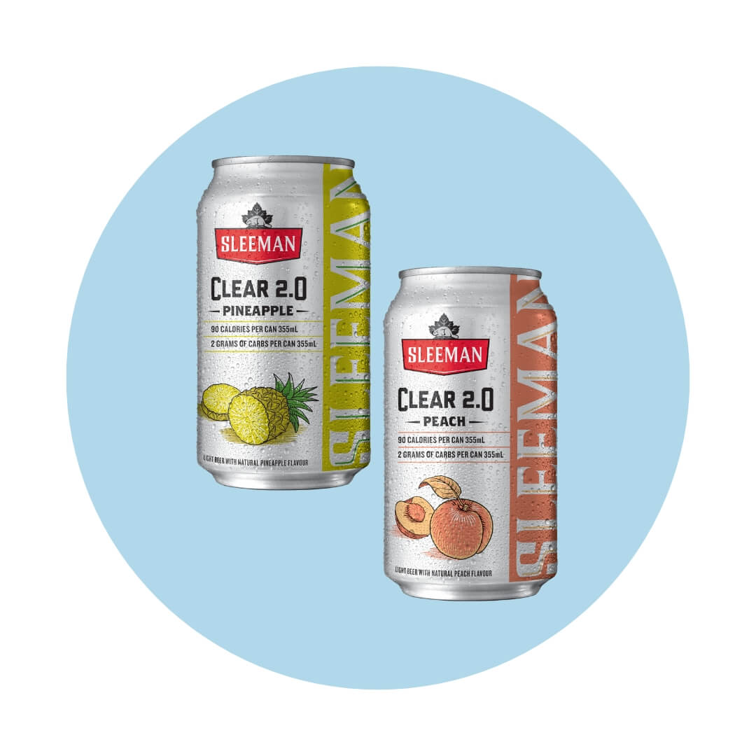 Two beer cans with fruit illustrations over a light blue circle graphic