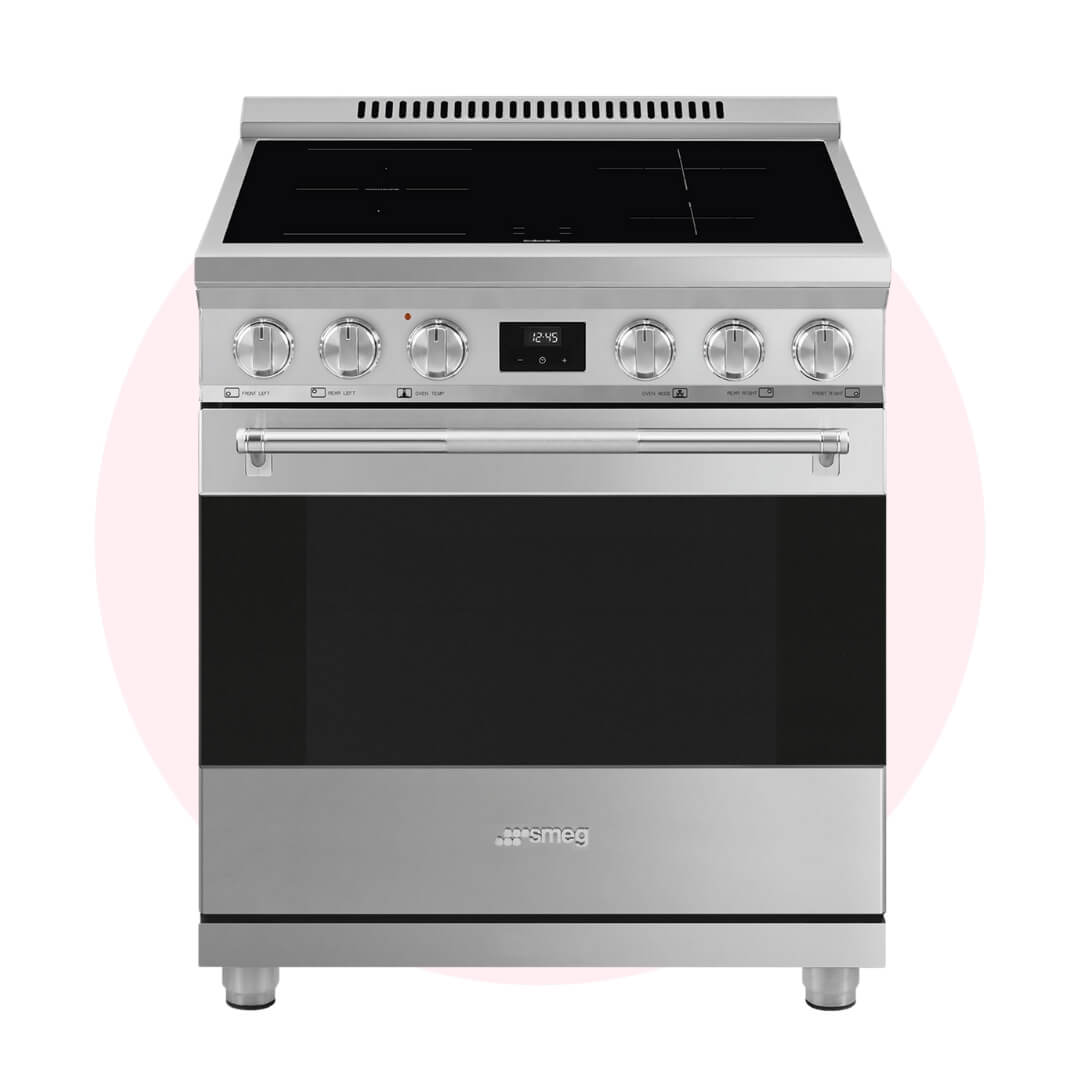 A silver oven-stove combination with a black induction cooktop over a pale pink circle graphic