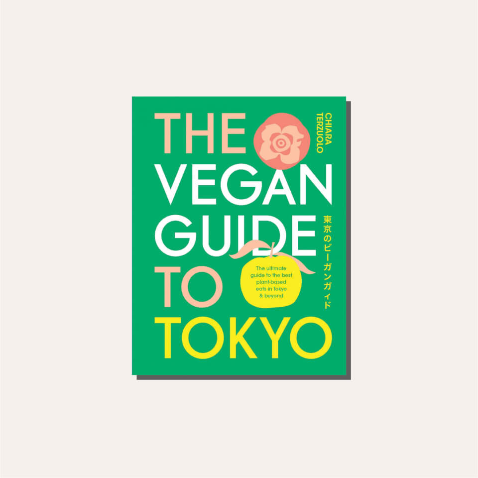 A green book cover in a light tan frame