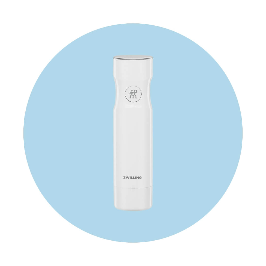 A white cylindrical pump with silver hardware and Zwilling branding on a light blue circle graphic