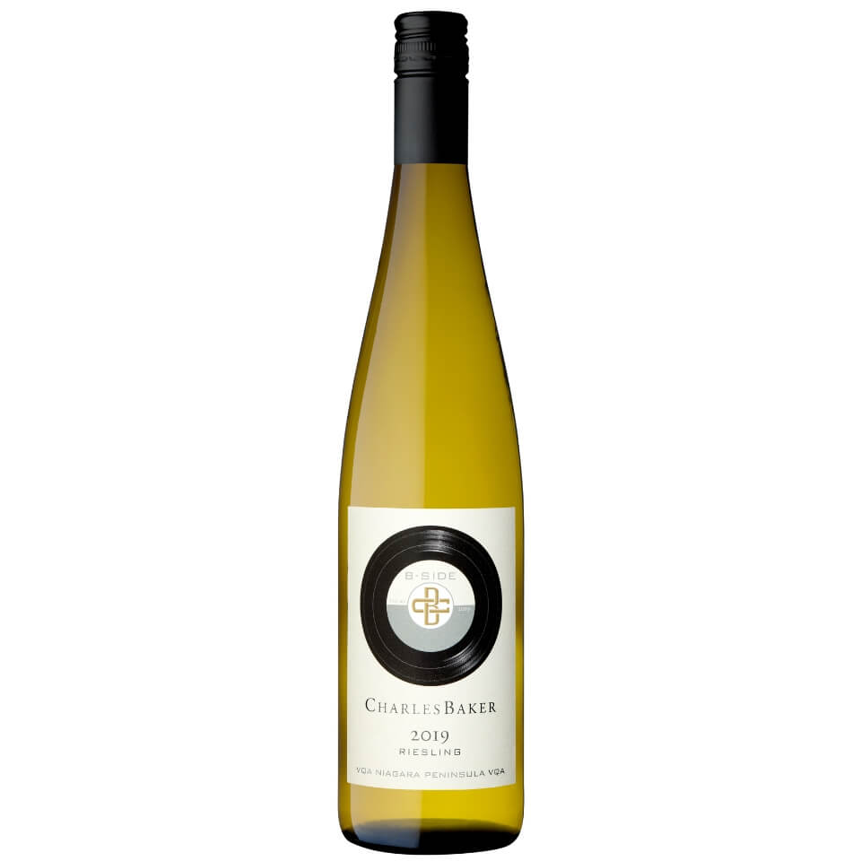 A bottle of white wine with a record on the label