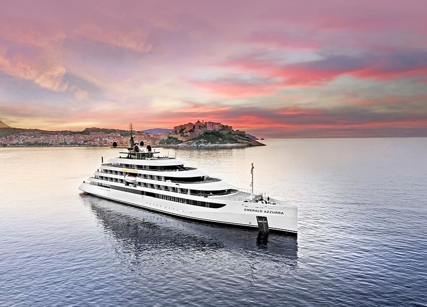 white cruise ship on water at sunset