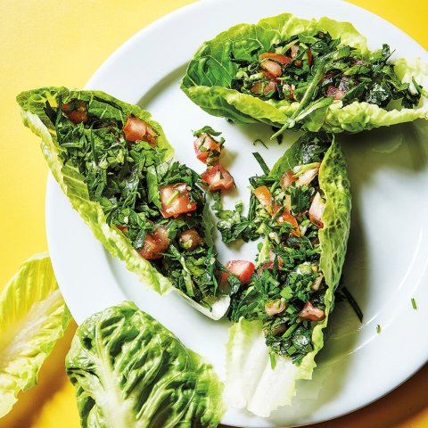 Tabbouleh and lettuce cups on a bright yellow surface
