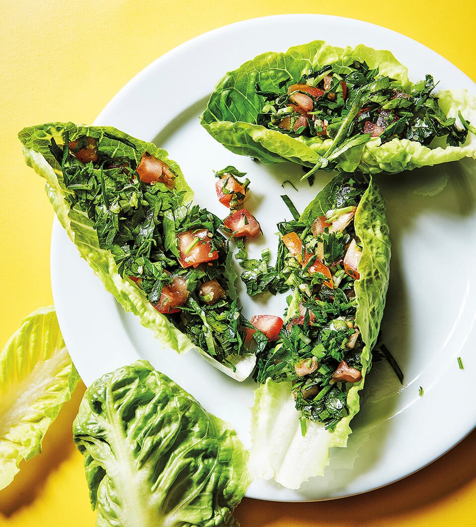 Tabbouleh and lettuce cups on a bright yellow surface
