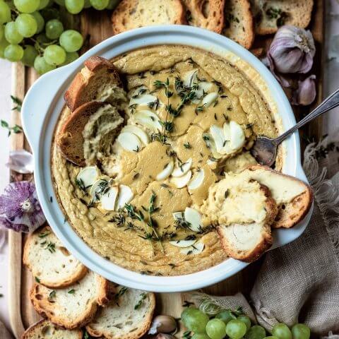 overhead shot of white bowl with baked cheese