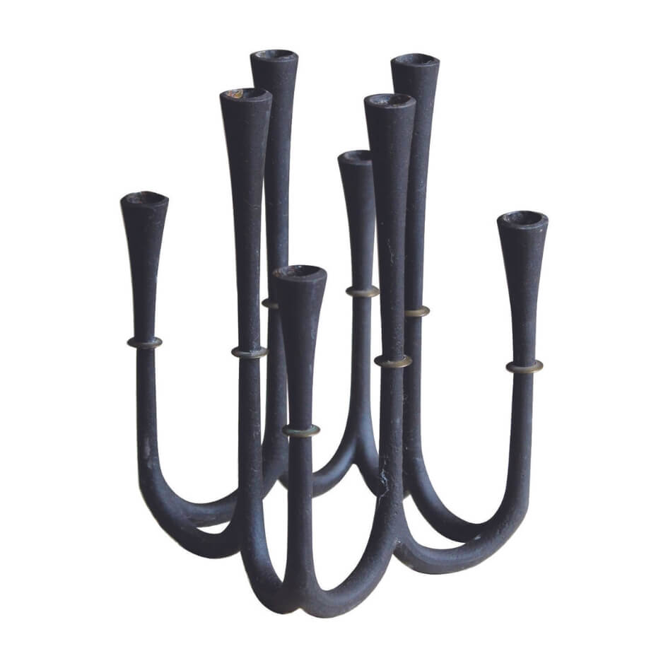 A dark sculptural candelabra