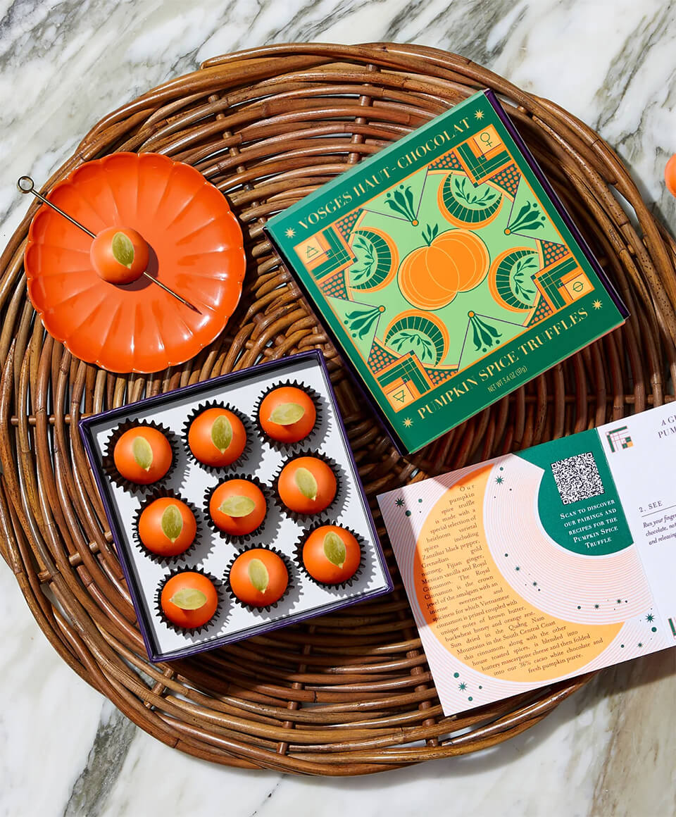 A wicker table with a box of pumpkin truffles