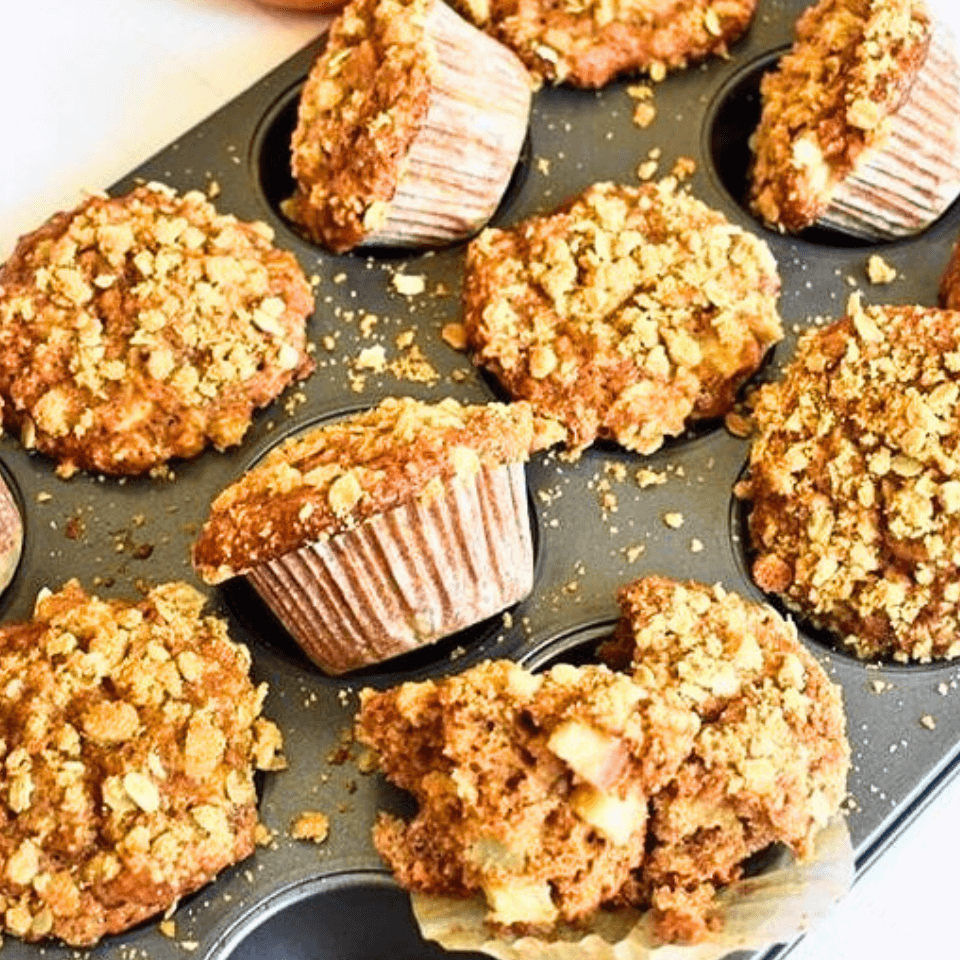 apple cinnamon muffins in a muffin tin