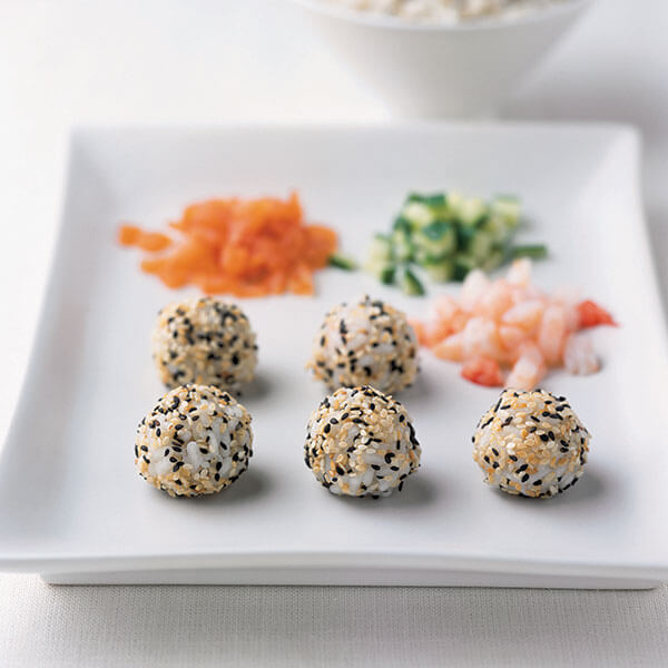 A plate of rice balls crusted with sesame seeds