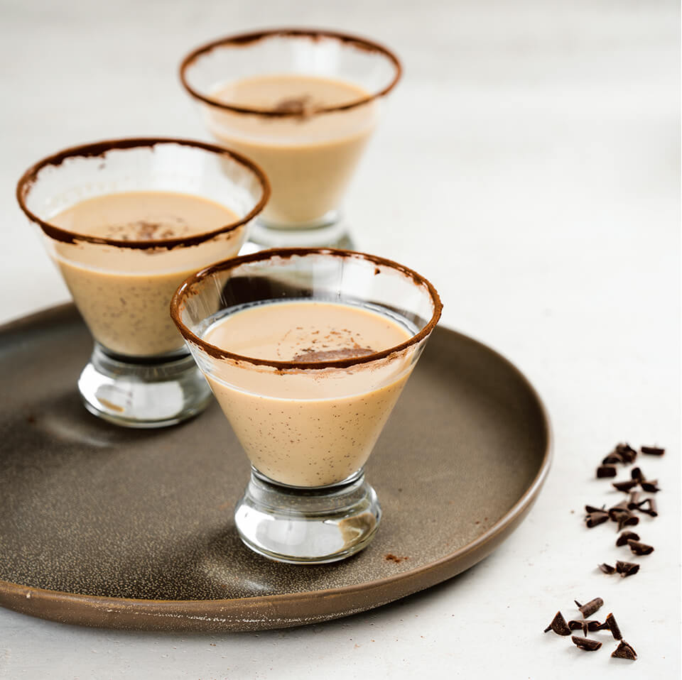 A tray with chocolate martinis in stemless glasses
