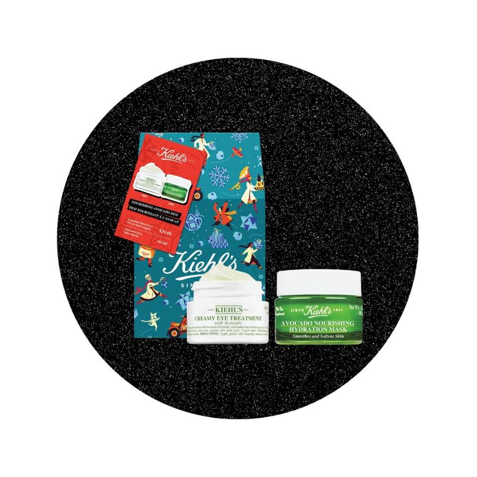 A teal gift bag, white canister and green canister in a black sparkly circle