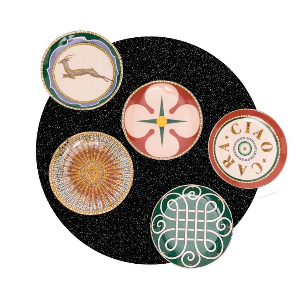 Five plates over a sparkly black circle