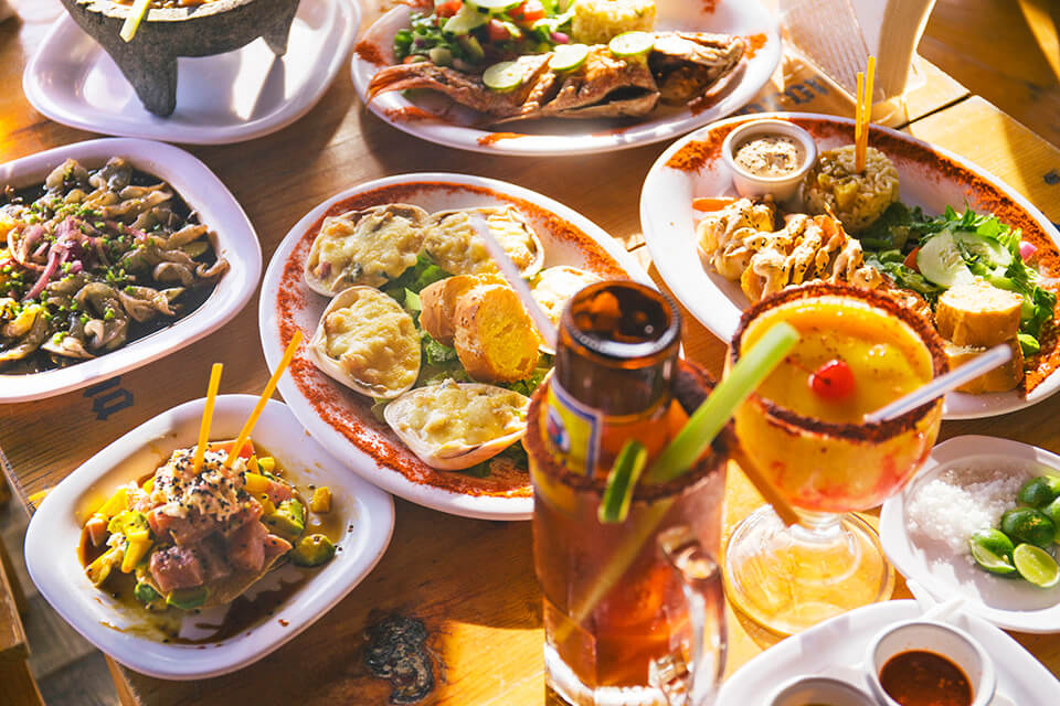 Various Mexican dishes on a table